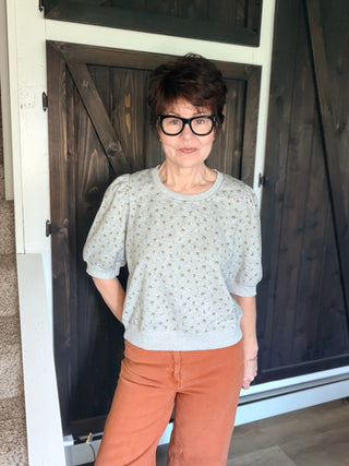 Ayla Floral Puff Sleeve Terry Top – H Grey-Tops CasualAyla Floral Puff Sleeve Terry Top - H Grey| VerClare Boutique | Jenison MI -Floral Puff Sleeve Terry Top is a beautiful cotton-blend French terry knit short-sleeve top featuring a soft floral print, feminine puff sleeves, and a relaxed everyday silhouette. US shipping on eligible orders-VerClare Boutique