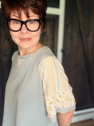 Daria French Terry Top - Lt. Blue-Tops CasualDaria French Terri Top - Lt. Blue | VerClare Boutique | Jenison MI -This French Terry Top is a beautiful soft mineral-washed French terry short-sleeve top featuring mixed print panel detailing, a classic round neckline, and an easy everyday silhouette. Free US shipping from VerClare Boutique.-VerClare Boutique