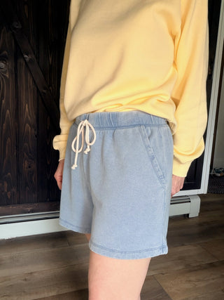 Hunter Knit Denim Short - Ocean Air Indigo-BottomsHunter Knit Denim Short - Ocean Air Indigo | VerClare Boutique | Jenison MI -The Z Supply Hunter Knit Denim Short is a beautiful knit denim French terry high-rise short featuring a contrast drawcord waistband, a relaxed silhouette, and functional slash pockets. Free US shipping on eligible orders. -VerClare Boutique