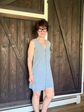 Solace Denim Mini Dress - Ocean Air Indigo-Dresses & RompersSolace Denim Mini Dress - Ocean Air Indigo | VerClare Boutique | Jenison MI -The Z Supply Solace Denim Mini Dress is a beautiful cotton knit jersey sleeveless mini dress featuring a flattering V-neckline, a button-front design, and an easy, everyday silhouette. Free US shipping on eligible orders. -VerClare Boutique