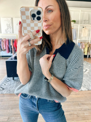 Calista Striped Polo Sweater - Navy Peach-SweatersCalista Striped Polo Sweater - Navy Peach | VerClare Boutique | Jenison MI -Striped Polo Sweater is a beautiful soft cotton knit polo sweater top featuring classic navy micro-stripes, a polished polo collar, and vibrant peach-pink contrast ribbing at the hems. Free US shipping from VerClare Boutique.-VerClare Boutique