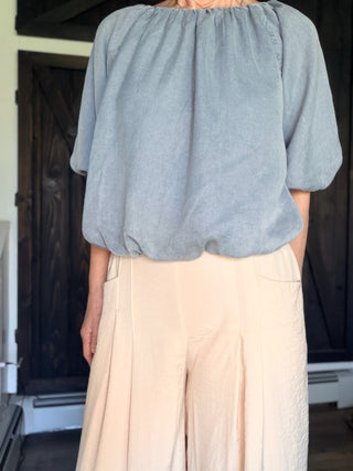 Gaia Pleat Wide-Leg Pants - Tan-BottomsGaia Pleat Wide-Leg Pants - Tan | VerClare Boutique | Jenison MI -Pleat Wide-Leg Pants are a beautiful lightweight woven cropped wide-leg pant featuring elegant pleat detailing, a comfortable pull-on waistband with elastic back, and functional side pockets. Free US shipping from VerClare Boutique.-VerClare Boutique