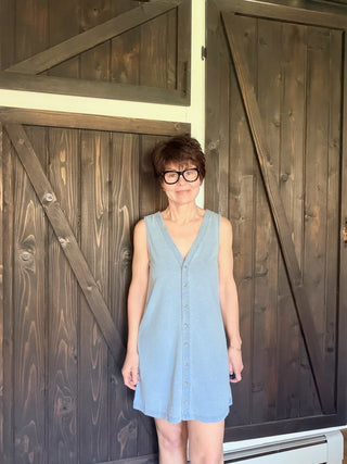 Solace Denim Mini Dress - Ocean Air Indigo-Dresses & RompersSolace Denim Mini Dress - Ocean Air Indigo | VerClare Boutique | Jenison MI -The Z Supply Solace Denim Mini Dress is a beautiful cotton knit jersey sleeveless mini dress featuring a flattering V-neckline, a button-front design, and an easy, everyday silhouette. Free US shipping on eligible orders. -VerClare Boutique
