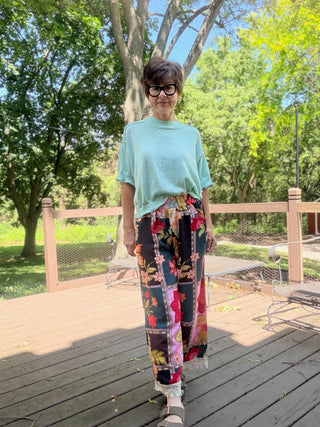 Celia Abstract Patchwork Print Pants - Pink Mix-BottomsUmgee Celia Abstract Patchwork Print Pants - Pink Mix | VerClare Boutique-Shop the Umgee Celia Abstract Patchwork Print Pants in Pink Mix. Lightweight rayon woven, floral patchwork, elastic waist, lace trim, relaxed fit. Sizes S–L.-VerClare Boutique