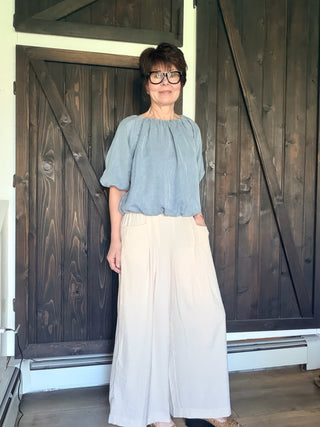 Gaia Pleat Wide-Leg Pants - Tan-BottomsGaia Pleat Wide-Leg Pants - Tan | VerClare Boutique | Jenison MI -Pleat Wide-Leg Pants are a beautiful lightweight woven cropped wide-leg pant featuring elegant pleat detailing, a comfortable pull-on waistband with elastic back, and functional side pockets. Free US shipping from VerClare Boutique.-VerClare Boutique