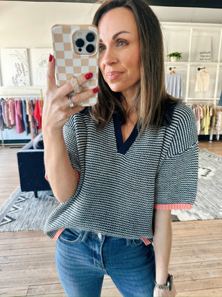 Calista Striped Polo Sweater - Navy Peach-SweatersCalista Striped Polo Sweater - Navy Peach | VerClare Boutique | Jenison MI -Striped Polo Sweater is a beautiful soft cotton knit polo sweater top featuring classic navy micro-stripes, a polished polo collar, and vibrant peach-pink contrast ribbing at the hems. Free US shipping from VerClare Boutique.-VerClare Boutique