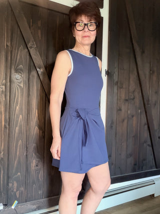 Valley Romper - Navy-Dresses & RompersValley Romper - Navy| VerClare Boutique | Jenison MI -Experience effortless style with the Navy Valley Romper by Thread & Supply. A flirty wrap skort design meets a sporty neckline for the perfect summer look! Free US shipping from VerClare Boutique on eligible orders.-VerClare Boutique
