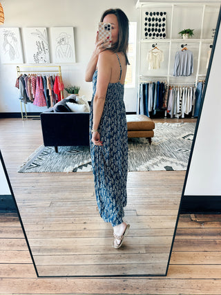 Taliah Boho Sleeveless Jumpsuit - Indigo-Dresses & RompersTaliah Boho Sleeveless Jumpsuit - Indigo | VerClare Boutique | Jenison MI -This Boho Sleeveless Jumpsuit is a beautiful lightweight woven rayon sleeveless jumpsuit featuring a relaxed boho-inspired silhouette, an easy pull-on design, and flowy wide-leg styling. Free US shipping from VerClare Boutique.-VerClare Boutique