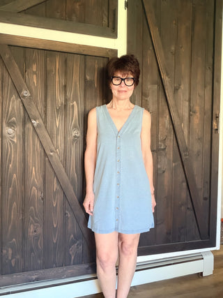 Solace Denim Mini Dress - Ocean Air Indigo-Dresses & RompersSolace Denim Mini Dress - Ocean Air Indigo | VerClare Boutique | Jenison MI -The Z Supply Solace Denim Mini Dress is a beautiful cotton knit jersey sleeveless mini dress featuring a flattering V-neckline, a button-front design, and an easy, everyday silhouette. Free US shipping on eligible orders. -VerClare Boutique
