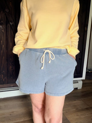 Hunter Knit Denim Short - Ocean Air Indigo-BottomsHunter Knit Denim Short - Ocean Air Indigo | VerClare Boutique | Jenison MI -The Z Supply Hunter Knit Denim Short is a beautiful knit denim French terry high-rise short featuring a contrast drawcord waistband, a relaxed silhouette, and functional slash pockets. Free US shipping on eligible orders. -VerClare Boutique