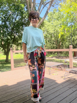 Celia Abstract Patchwork Print Pants - Pink Mix-BottomsUmgee Celia Abstract Patchwork Print Pants - Pink Mix | VerClare Boutique-Shop the Umgee Celia Abstract Patchwork Print Pants in Pink Mix. Lightweight rayon woven, floral patchwork, elastic waist, lace trim, relaxed fit. Sizes S–L.-VerClare Boutique