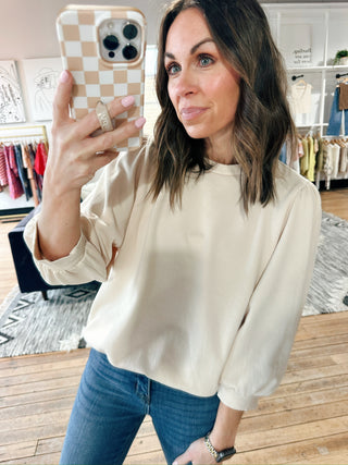 Malia Puff Sleeve Top - Vanilla-Tops Basic SolidMalia Puff Sleeve Top - Vanilla | VerClare Boutique | Jenison MI -Puff Sleeve Top is a beautiful soft French terry knit pull-over top featuring 3/4 puff sleeves, volume sleeve detail, and a garment-washed finish for an ultra-soft touch. Free US shipping from VerClare Boutique.-VerClare Boutique