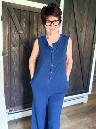 Fiona Jersey Denim Jumpsuit - Indigo-Dresses & RompersFiona Jersey Denim Jumpsuit - Indigo| VerClare Boutique | Jenison MI -The Z Supply Fiona Jersey Denim Jumpsuit is a beautiful cotton knit jersey sleeveless jumpsuit featuring a Henley-style button front, side seam pockets, and an easy relaxed silhouette. Free US shipping on eligible orders. -VerClare Boutique