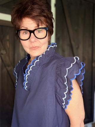 Bev Poplin Top - Navy-Tops CasualBev Poplin Top | VerClare Boutique | Jenison MI -This beautiful 100% cotton top features an embroidered scalloped v-neck with stand-up collar and embroidering around sleeves. The fit is oversized. Free US shipping on eligible orders. -VerClare Boutique