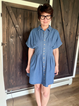 Galilea Pleated Denim Mini Dress - Denim-Dresses & RompersBelle Stripe Soft Brushed Top – Denim Blue Combo | VerClare Boutique | Jenison MI -This Pleated Denim Mini Dress is a beautiful structured denim woven button-front mini dress featuring a classic collared neckline, short dolman sleeves, and front and back pleat detailing that defines the waist. Free US shipping from VerClare Boutique.-VerClare Boutique