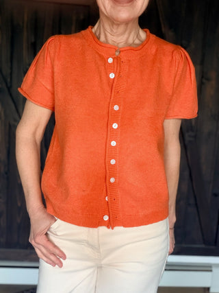 Rena Short Sleeve Sweater Cardigan - Orange-SweatersRena Short Sleeve Sweater Cardigan in Orange | VerClare Boutique-Shop the &merci Rena Short Sleeve Sweater Cardigan in Orange — puff shoulders, ribbed neck, button-down placket, semi-cropped fit. Sizes S–L. $59.99-VerClare Boutique