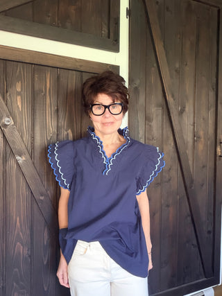 Bev Poplin Top - Navy-Tops CasualBev Poplin Top | VerClare Boutique | Jenison MI -This beautiful 100% cotton top features an embroidered scalloped v-neck with stand-up collar and embroidering around sleeves. The fit is oversized. Free US shipping on eligible orders. -VerClare Boutique