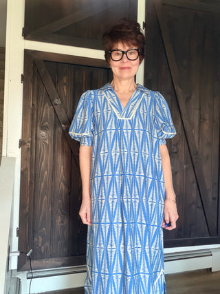 Cora Geometric Print Midi Dress - Cerulean-Dresses & RompersCora Geometric Print Midi Dress | VerClare Boutique | Jenison MI -Midi dress featuring a geometric leaf-inspired pattern, a flattering V-neckline, and short puff sleeves. Fits true to size with a relaxed flowy silhouette. Perfect for brunch, vacations, casual outings, or everyday wear. Free US shipping from VerClare Boutique.-VerClare Boutique