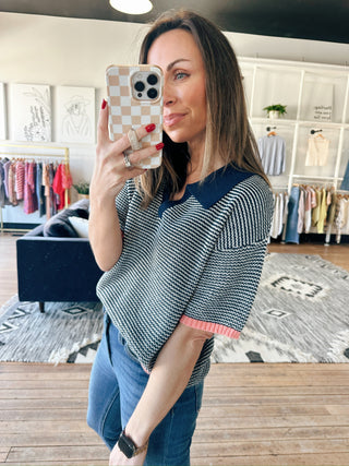 Calista Striped Polo Sweater - Navy Peach-SweatersCalista Striped Polo Sweater - Navy Peach | VerClare Boutique | Jenison MI -Striped Polo Sweater is a beautiful soft cotton knit polo sweater top featuring classic navy micro-stripes, a polished polo collar, and vibrant peach-pink contrast ribbing at the hems. Free US shipping from VerClare Boutique.-VerClare Boutique