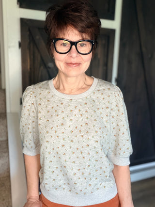 Ayla Floral Puff Sleeve Terry Top – H Grey-Tops CasualAyla Floral Puff Sleeve Terry Top - H Grey| VerClare Boutique | Jenison MI -Floral Puff Sleeve Terry Top is a beautiful cotton-blend French terry knit short-sleeve top featuring a soft floral print, feminine puff sleeves, and a relaxed everyday silhouette. US shipping on eligible orders-VerClare Boutique
