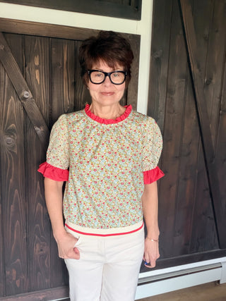 Gemma Contrast Ruffle Floral Embroidered Top-Tops CasualGemma Contrast ruffle Floral Embroidered Top | VerClare Boutique | Jenison MI-This is a beautiful floral print, round neckline, eyelet embroidered short puff sleeve, contrast colored solid ruffle detail, back neck button and loop closure and a striped elastic banded hem. Free US shipping from VerClare Boutique on eligible orders.-VerClare Boutique
