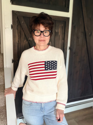 American Flag Sweater - White-SweatersAmerican Flag Sweater - White | VerClare Boutique | Jenison MI -Show your stripes — literally. The By Together American Flag Sweater in White is a fun, feel-good piece that brings a little patriotic spirit to your everyday wardrobe. Crafted in a soft knit with a classic American flag design, this sweater is casual enough for weekend wear but styled enough to make a statement. Free US shipping from VerClare Boutique on eligible orders.-VerClare Boutique