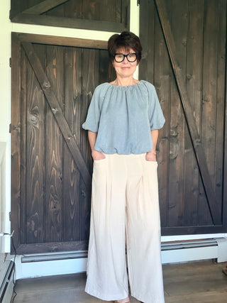 Gaia Pleat Wide-Leg Pants - Tan-BottomsGaia Pleat Wide-Leg Pants - Tan | VerClare Boutique | Jenison MI -Pleat Wide-Leg Pants are a beautiful lightweight woven cropped wide-leg pant featuring elegant pleat detailing, a comfortable pull-on waistband with elastic back, and functional side pockets. Free US shipping from VerClare Boutique.-VerClare Boutique
