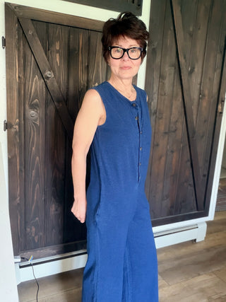 Fiona Jersey Denim Jumpsuit - Indigo-Dresses & RompersFiona Jersey Denim Jumpsuit - Indigo| VerClare Boutique | Jenison MI -The Z Supply Fiona Jersey Denim Jumpsuit is a beautiful cotton knit jersey sleeveless jumpsuit featuring a Henley-style button front, side seam pockets, and an easy relaxed silhouette. Free US shipping on eligible orders. -VerClare Boutique