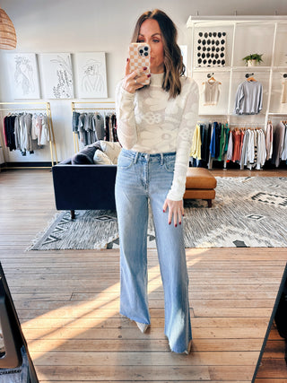 Tovia Raw Hem Wide Jeans-BottomsTovia Raw Hem Wide Leg Jeans for Women | VerClare Boutique | Chenoa, IL-Shop the Tovia Raw Hem Wide Leg Jeans at VerClare Boutique. High-rise fit with a raw hem and relaxed wide leg silhouette—perfect for everyday wear. Fast shipping available.-VerClare Boutique
