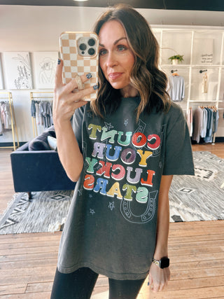 Count Your Lucky Stars Tee - Charcoal-Tops Basic PrintCount Your Lucky Stars Tee – Charcoal | VerClare Boutique | Chenoa, IL-Shop the Count Your Lucky Stars Tee in charcoal at VerClare Boutique. A casual graphic tee with an easy, everyday feel—perfect for layering or wearing on its own.-VerClare Boutique