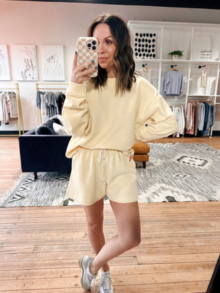 Nina Soft-Touch Pullover Set - Lemon-Jackets & KimonosNina Soft-Touch Pullover Set – Lemon | VerClare Boutique | Chenoa, IL-Cozy meets cute with the Nina Soft-Touch Pullover Set in Lemon. Ultra-soft fabric with a relaxed pullover and drawstring shorts—perfect for lounging, errands, or casual days. Shop now at VerClare Boutique.-VerClare Boutique