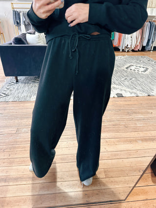 Z Supply Downtown Wide Leg Sweatpant - Black-BottomsZ Supply Downtown Wide Leg Sweatpant – Black | VerClare Boutique | Chenoa, IL-Z Supply Downtown wide leg sweatpant in black with a relaxed, comfy fit and soft feel. Elevated loungewear perfect for everyday wear. Free US shipping from VerClare Boutique.-VerClare Boutique