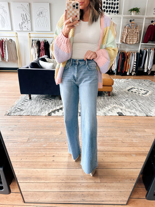 Tovia Raw Hem Wide Jeans-BottomsTovia Raw Hem Wide Leg Jeans for Women | VerClare Boutique | Chenoa, IL-Shop the Tovia Raw Hem Wide Leg Jeans at VerClare Boutique. High-rise fit with a raw hem and relaxed wide leg silhouette—perfect for everyday wear. Fast shipping available.-VerClare Boutique