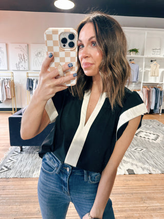 Amina Flutter Sleeve V-Neck Top - Black-Tops CasualAmina Flutter Sleeve V-Neck Top – Black | VerClare Boutique | Chenoa, IL-Chic black flutter sleeve V-neck top with a lightweight, flowy feel. Easy to dress up or down for everyday wear. Shop women’s boutique styles at VerClare Boutique.-VerClare Boutique