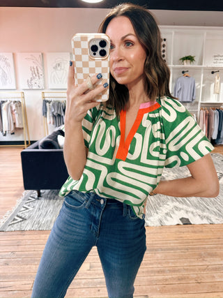 Tiana Pattern V-Neck Top - Green-Tops CasualTiana Pattern V-Neck Top – Green | VerClare Boutique | Chenoa, IL-Shop the Tiana Pattern V-Neck Top in green at VerClare Boutique. A bold yet wearable patterned top with a flattering v-neck, perfect for everyday outfits with personality.-VerClare Boutique