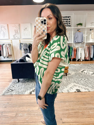 Tiana Pattern V-Neck Top - Green-Tops CasualTiana Pattern V-Neck Top – Green | VerClare Boutique | Chenoa, IL-Shop the Tiana Pattern V-Neck Top in green at VerClare Boutique. A bold yet wearable patterned top with a flattering v-neck, perfect for everyday outfits with personality.-VerClare Boutique