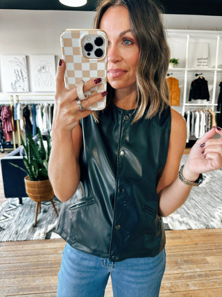 Snap! Vegan Leather Vest-Jackets & KimonosSnap! Vegan Leather Vest | VerClare Boutique | Chenoa, IL-Women's Front Button Vest | Snap! Vegan Leather Vest | Sizes: S, M, L | Color: Black | Free US shipping on all eligible orders. Located in Chenoa, Illinois-VerClare Boutique