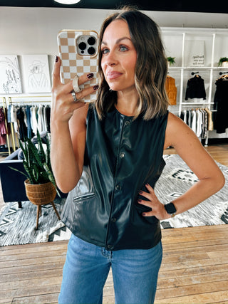 Snap! Vegan Leather Vest-Jackets & KimonosSnap! Vegan Leather Vest | VerClare Boutique | Chenoa, IL-Women's Front Button Vest | Snap! Vegan Leather Vest | Sizes: S, M, L | Color: Black | Free US shipping on all eligible orders. Located in Chenoa, Illinois-VerClare Boutique