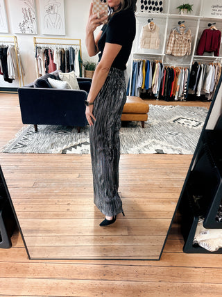 Galira Metallic Pleated Relaxed Pants - Black-BottomsWomen's Dress Pants | VerClare Boutique-Galira Metallic Pleated Relaxed Pant: Sizes: XS - XL. Color: Black. Fabric: 100% Polyester. Free Shipping on $100+ orders with VerClare Boutique in Chenoa, IL. -VerClare Boutique