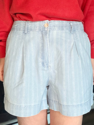 Junia Shorts - Blue Haze Wash-BottomsJunia Shorts - Blue Haze Wash | VerClare Boutique | Jenison MI -Discover the Junia High-Rise Shorts in Blue Haze. Featuring a vintage pinstripe, breathable fabric, and tailored pleats for the ultimate summer-ready look. Free US shipping on all eligible orders.-VerClare Boutique