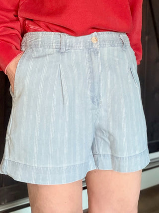Junia Shorts - Blue Haze Wash-BottomsJunia Shorts - Blue Haze Wash | VerClare Boutique | Jenison MI -Discover the Junia High-Rise Shorts in Blue Haze. Featuring a vintage pinstripe, breathable fabric, and tailored pleats for the ultimate summer-ready look. Free US shipping on all eligible orders.-VerClare Boutique
