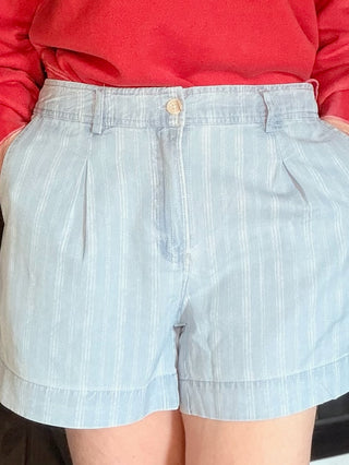 Junia Shorts - Blue Haze Wash-BottomsJunia Shorts - Blue Haze Wash | VerClare Boutique | Jenison MI -Discover the Junia High-Rise Shorts in Blue Haze. Featuring a vintage pinstripe, breathable fabric, and tailored pleats for the ultimate summer-ready look. Free US shipping on all eligible orders.-VerClare Boutique