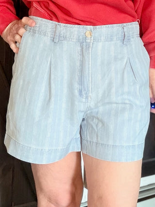 Junia Shorts - Blue Haze Wash-BottomsJunia Shorts - Blue Haze Wash | VerClare Boutique | Jenison MI -Discover the Junia High-Rise Shorts in Blue Haze. Featuring a vintage pinstripe, breathable fabric, and tailored pleats for the ultimate summer-ready look. Free US shipping on all eligible orders.-VerClare Boutique