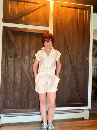 Danica Striped Zip Front Romper - Light Khaki-Dresses & RompersThe Workshop Danica Striped Zip Front Romper - Light Khaki | VerClare Boutique-Shop The Workshop Danica Striped Zip Front Romper in Light Khaki. Stretch knit, mock neck, front zip, drawstring waist, short sleeve. Sizes S–L.-VerClare Boutique