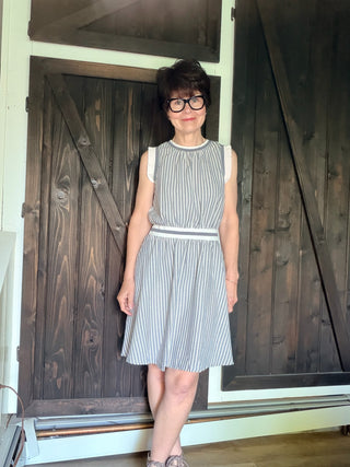 Shellie Ruffled Rib Band Dress-Dresses & RompersShellie Ruffled Rib Band Dress – Slater Blue | Voy – VerClare Boutique-Shop the Voy Shellie Ruffled Rib Band Dress in Slater Blue. 60% cotton 40% polyester, round neck, sleeveless, pockets, ruffle band, flared skirt, true to size. Sizes S–L.-VerClare Boutique