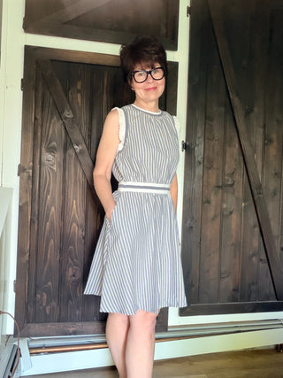 Shellie Ruffled Rib Band Dress-Dresses & RompersShellie Ruffled Rib Band Dress – Slater Blue | Voy – VerClare Boutique-Shop the Voy Shellie Ruffled Rib Band Dress in Slater Blue. 60% cotton 40% polyester, round neck, sleeveless, pockets, ruffle band, flared skirt, true to size. Sizes S–L.-VerClare Boutique