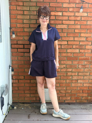 Novah Color Band Top & Shorts Sets - Navy-Tops CasualJODIFL Novah Color Band Top & Shorts Set - Navy | VerClare Boutique-Shop the JODIFL Novah Color Band Top & Shorts Set in Navy. Rayon-blend stretch knit, zip-up drop shoulder top, drawstring shorts, sporty matching set. Sizes S–L.-VerClare Boutique
