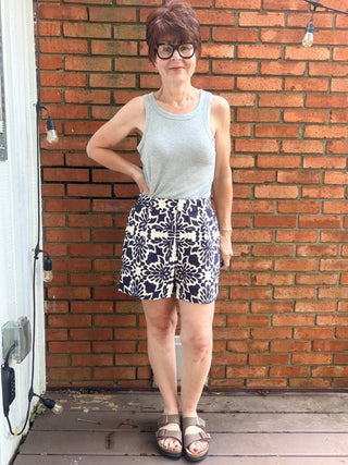 Zarina Tropical Print Shorts - Navy/Ivory-BottomsSkies Are Blue Zarina Tropical Print Shorts - Navy/Ivory | VerClare Boutique-Shop the Skies Are Blue Zarina Tropical Print Shorts in Navy/Ivory. Viscose woven, tropical print, relaxed summer silhouette, mid-rise. Sizes XS–L.-VerClare Boutique