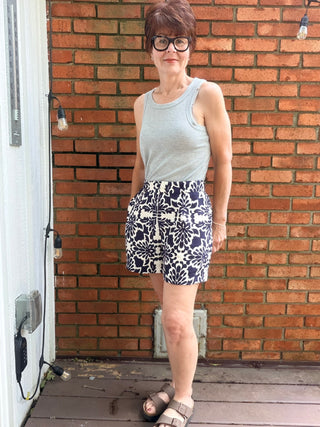 Zarina Tropical Print Shorts - Navy/Ivory-BottomsSkies Are Blue Zarina Tropical Print Shorts - Navy/Ivory | VerClare Boutique-Shop the Skies Are Blue Zarina Tropical Print Shorts in Navy/Ivory. Viscose woven, tropical print, relaxed summer silhouette, mid-rise. Sizes XS–L.-VerClare Boutique