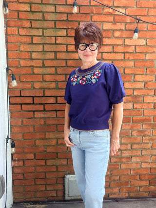 Scarlette Multi Color Embroidery Top - Navy-Tops Basic SolidVOY Scarlette Multi Color Embroidery Top - Navy | VerClare Boutique-Shop the VOY Scarlette Multi Color Embroidery Top in Navy. Soft knit, multicolor floral embroidery, scallop trim, round neck, feminine silhouette. Sizes S–L.-VerClare Boutique